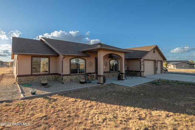 ranch-style home with a garage