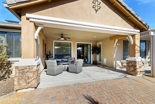 view of patio featuring ceiling fan