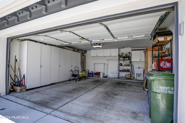 garage featuring water heater and sink