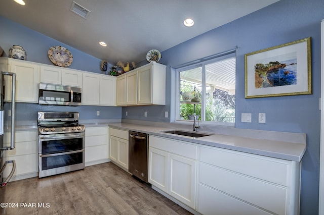 kitchen featuring white cabinets, sink, and stainless steel appliances