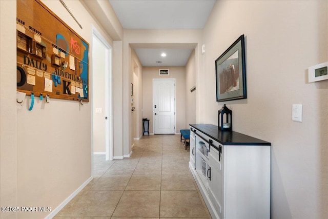 921 N Soliz St, Dewey-Humboldt, AZ 86327 - hall with light tile patterned floors, baseboards, and recessed lighting
