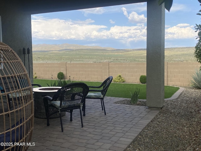 921 N Soliz St, Dewey-Humboldt, AZ 86327 - view of patio featuring a mountain view and an outdoor fire pit
