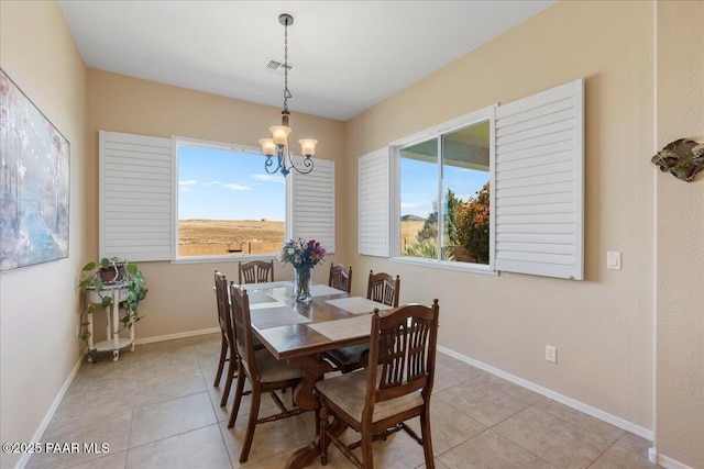 921 N Soliz St, Dewey-Humboldt, AZ 86327 - dining room featuring healthy amount of natural light, a chandelier, and light tile patterned floors