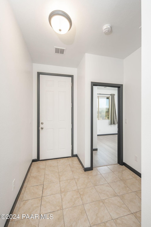 interior space with light tile patterned floors