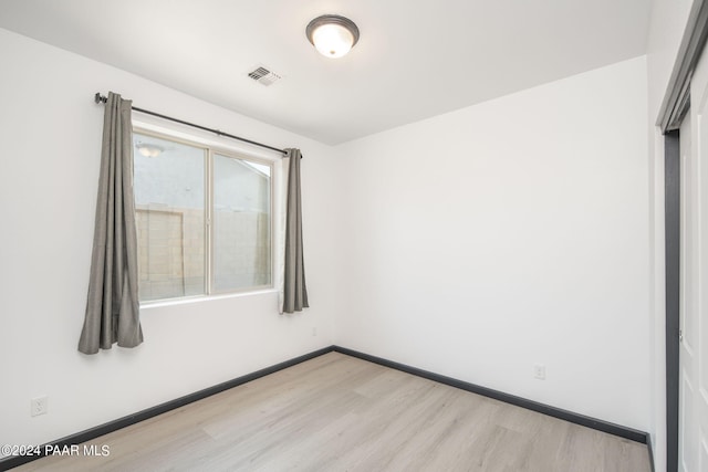 unfurnished room featuring light hardwood / wood-style flooring