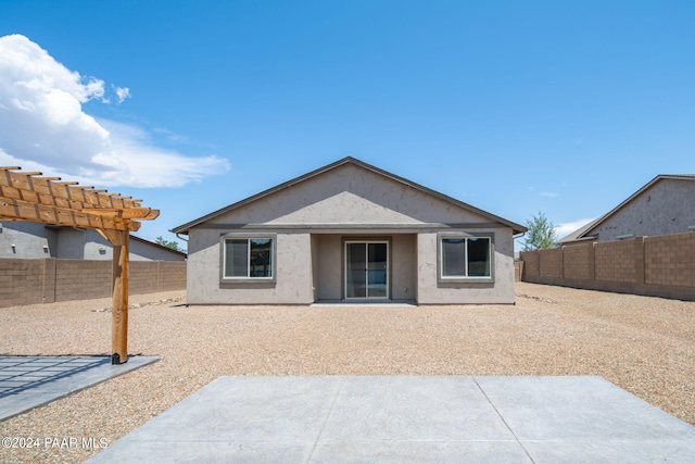 back of house with a patio area and a pergola