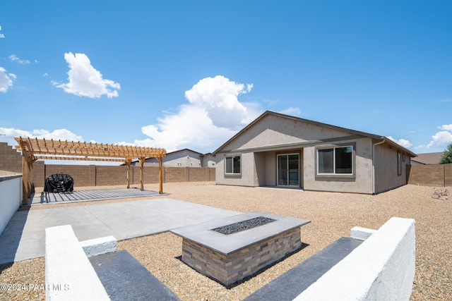 view of patio featuring a fire pit and a pergola