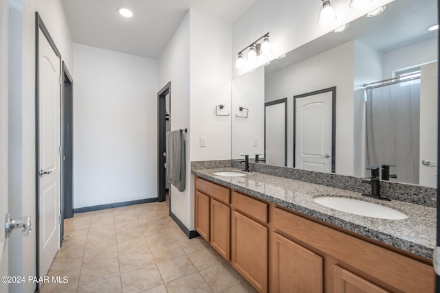 bathroom with vanity and tile patterned floors