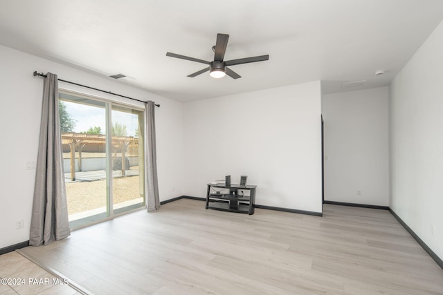 empty room featuring light hardwood / wood-style floors and ceiling fan