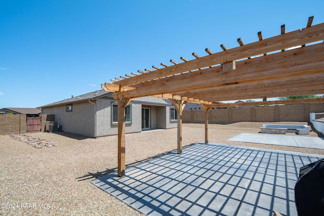 view of patio featuring a pergola and central AC