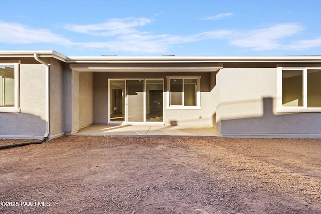 back of property featuring a patio