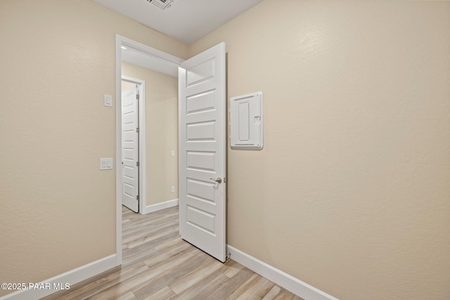 hall with light wood-type flooring