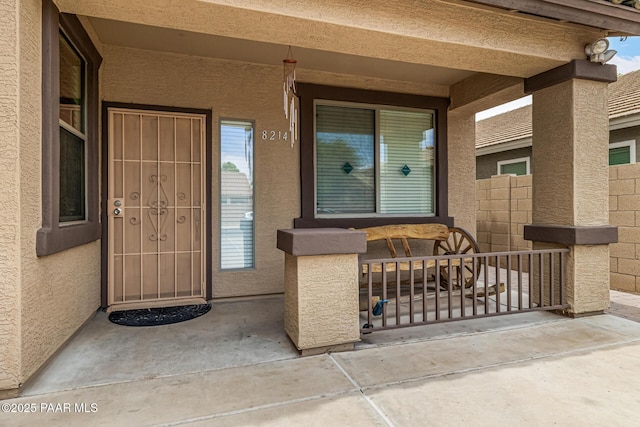 8214 S 48th Dr, Laveen, AZ 85339 - property entrance with covered porch and stucco siding