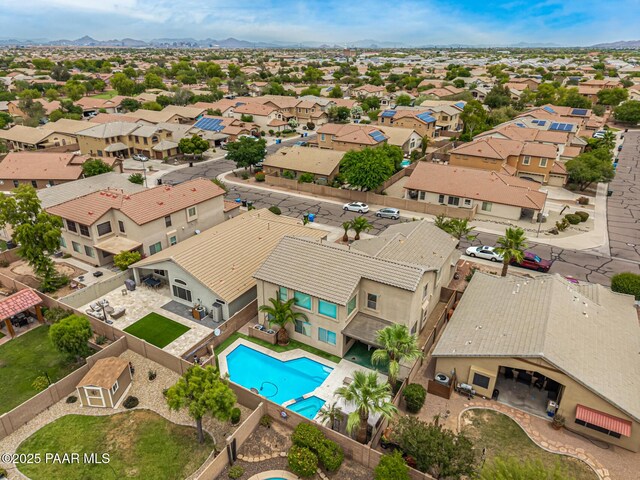 8214 S 48th Dr, Laveen, AZ 85339 - aerial view of residential area with a pool area and a mountainous background