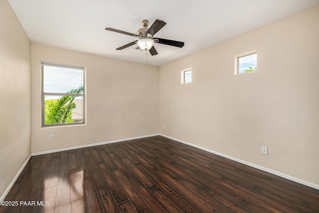 8214 S 48th Dr, Laveen, AZ 85339 - empty room with dark wood-style flooring and ceiling fan