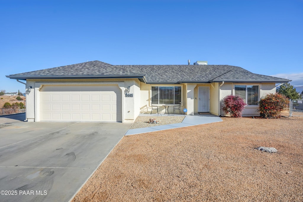 single story home with a garage