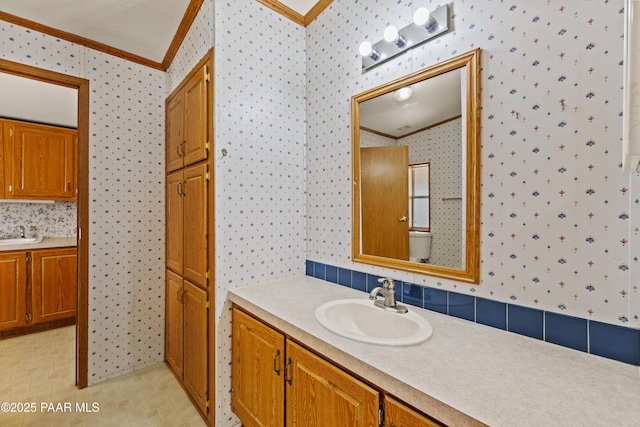 bathroom with vanity and crown molding