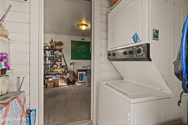 clothes washing area with stacked washer / drying machine