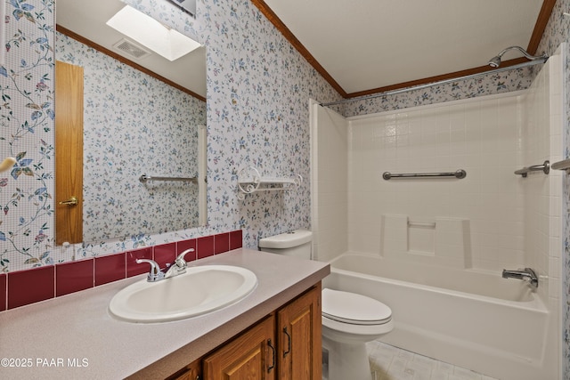 full bathroom with a skylight, shower / bath combination, ornamental molding, vanity, and toilet