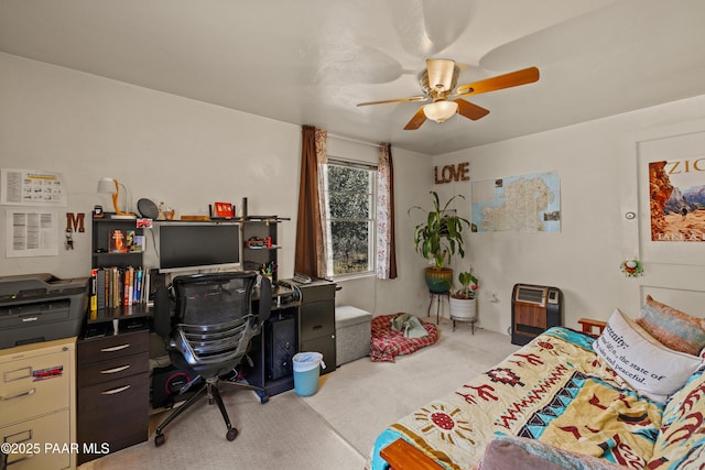 carpeted bedroom with ceiling fan and heating unit