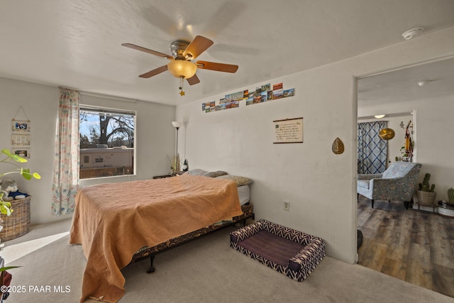 bedroom with hardwood / wood-style flooring and ceiling fan