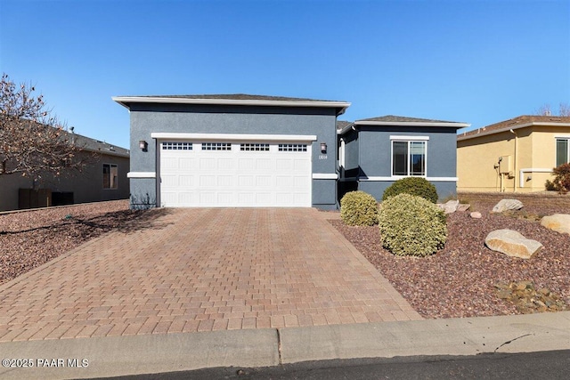 13014 E Vega St, Dewey-Humboldt, AZ 86327 - view of front facade with decorative driveway, stucco siding, and an attached garage