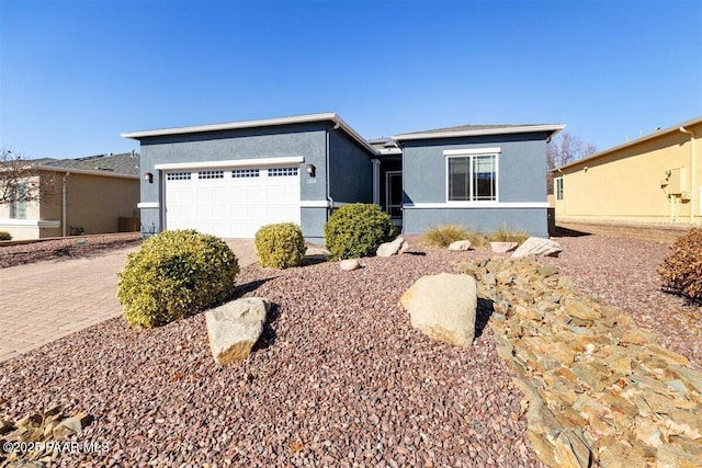 ranch-style house featuring a garage