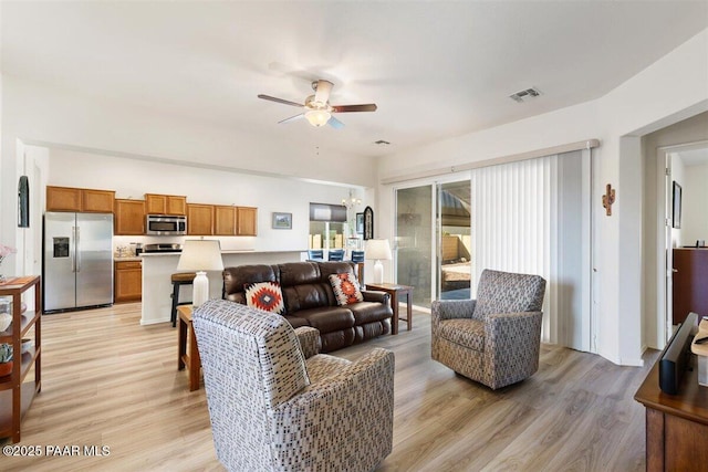 13014 E Vega St, Dewey-Humboldt, AZ 86327 - living room featuring ceiling fan and light wood-style flooring