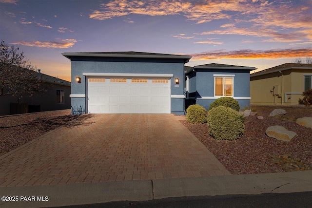 prairie-style house featuring a garage