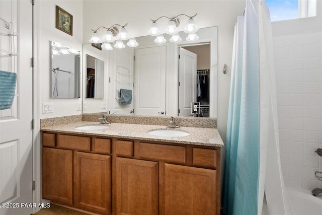 bathroom featuring shower / bath combination with curtain and vanity