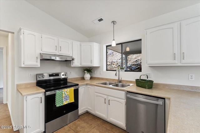 kitchen with visible vents, under cabinet range hood, white cabinets, stainless steel appliances, and a sink