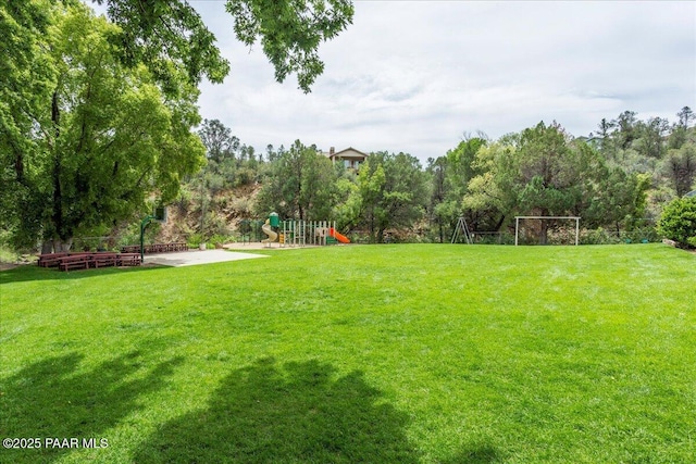 view of yard featuring playground community