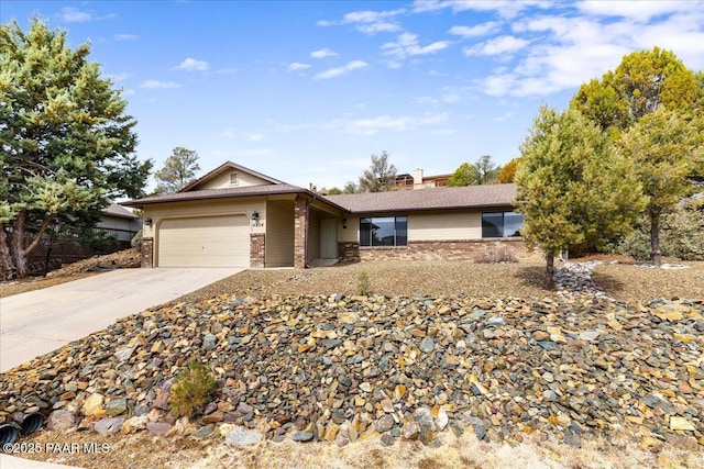 ranch-style house featuring a garage, brick siding, and concrete driveway