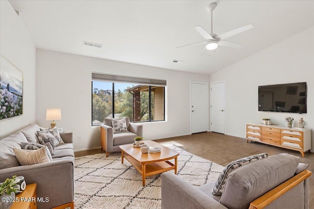 living room featuring vaulted ceiling, a ceiling fan, visible vents, and baseboards