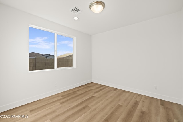 unfurnished room featuring light wood-type flooring