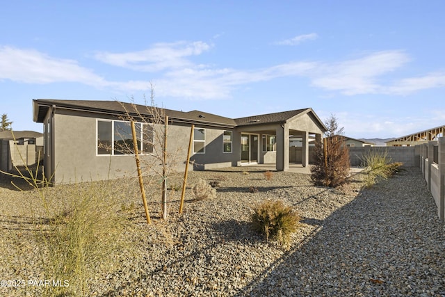 back of property featuring a patio area