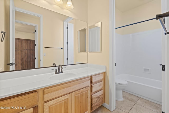 full bathroom with tile patterned floors, shower / bathing tub combination, vanity, and toilet