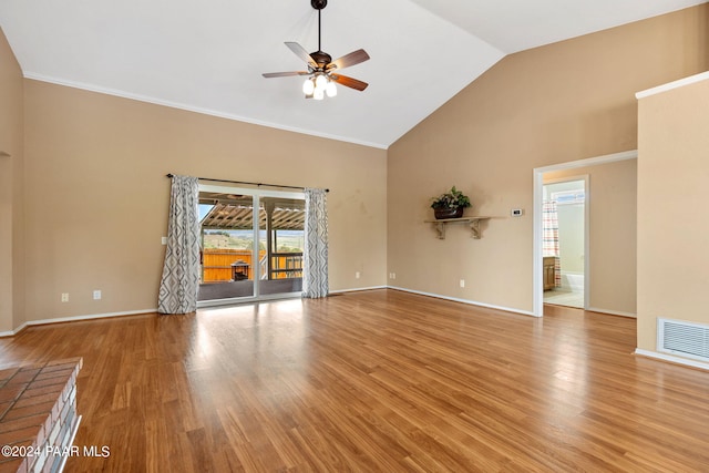 unfurnished living room featuring a ceiling fan, wood finished floors, visible vents, and baseboards