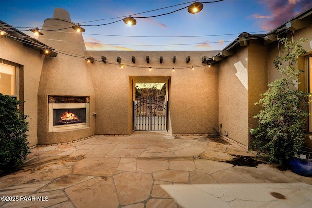 5560 W Halcyone Cir, Prescott, AZ 86305 - property entrance with a patio area and stucco siding