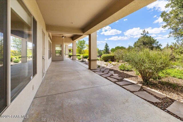 5560 W Halcyone Cir, Prescott, AZ 86305 - back of property with a tile roof, a patio area, a chimney, and stucco siding