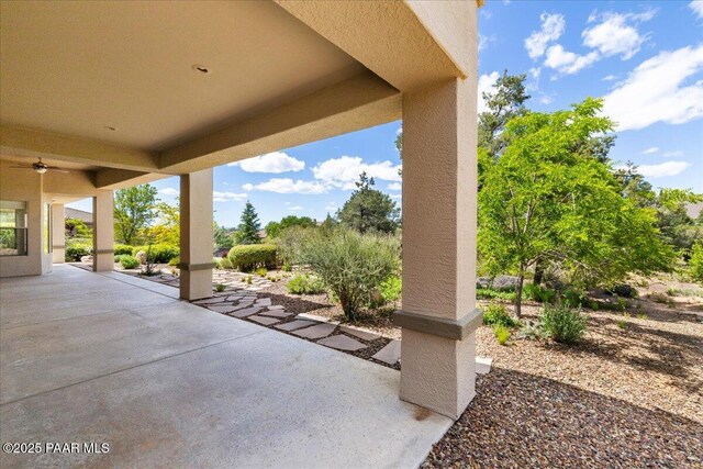 5560 W Halcyone Cir, Prescott, AZ 86305 - view of front of home featuring stucco siding, a tile roof, a chimney, and a patio