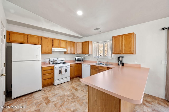 kitchen featuring light countertops, visible vents, a peninsula, white appliances, and under cabinet range hood