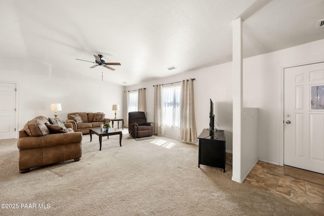 living area with ceiling fan, carpet, visible vents, and baseboards