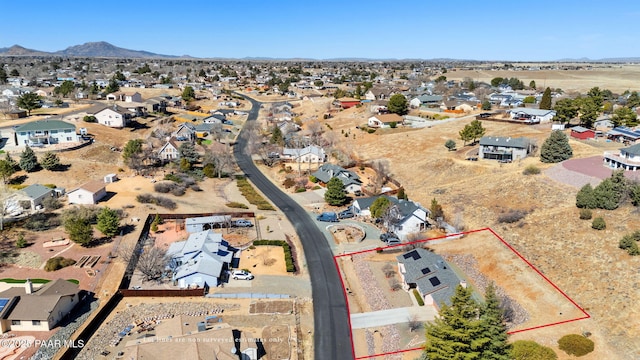 drone / aerial view with a residential view and a mountain view