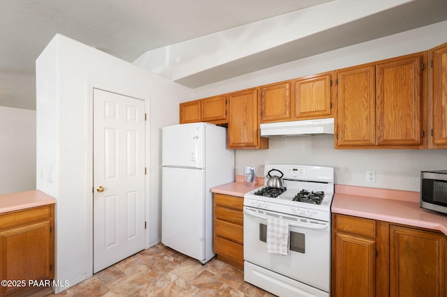 kitchen featuring brown cabinetry, white appliances, light countertops, and under cabinet range hood