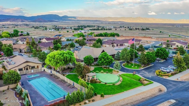 7812 E Rusty Spur Trl, Prescott Valley, AZ 86315 - aerial perspective of suburban area with a mountain backdrop and a pool area