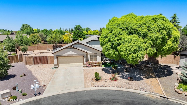 7812 E Rusty Spur Trl, Prescott Valley, AZ 86315 - view of front facade featuring concrete driveway, an attached garage, and stucco siding