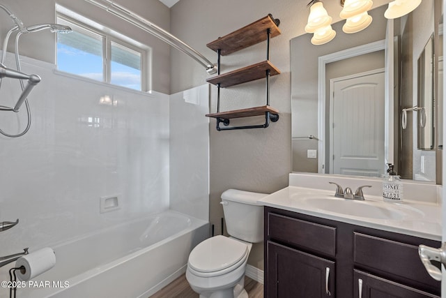 bathroom with bathtub / shower combination, wood finished floors, toilet, and vanity