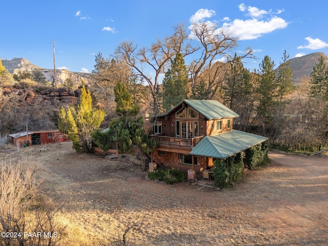 back of house featuring a mountain view