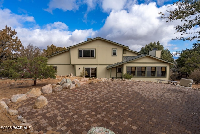 view of property featuring a patio area